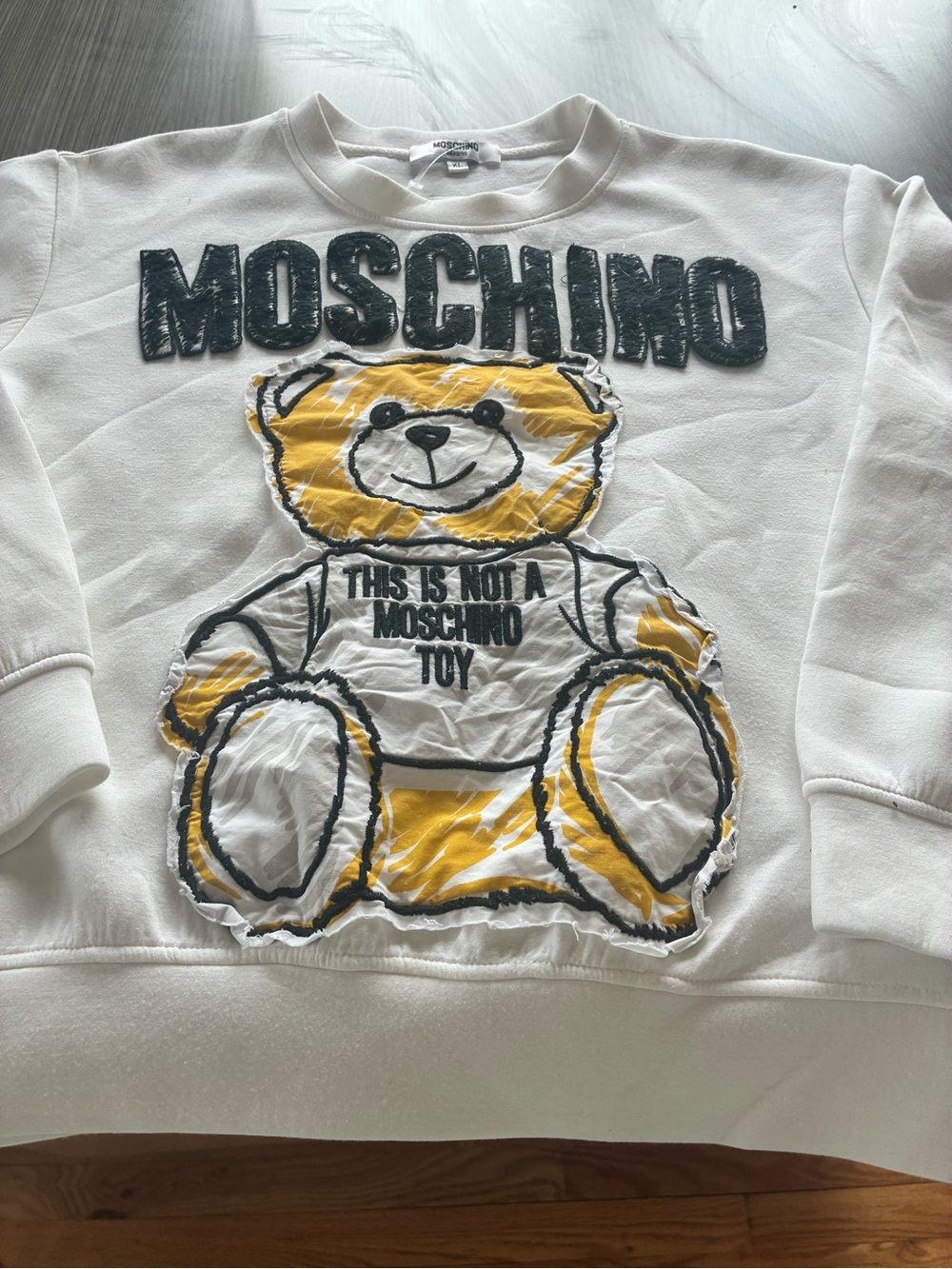 Moschino White Crewneck with Black Appliqué Logo and Yellow Accent